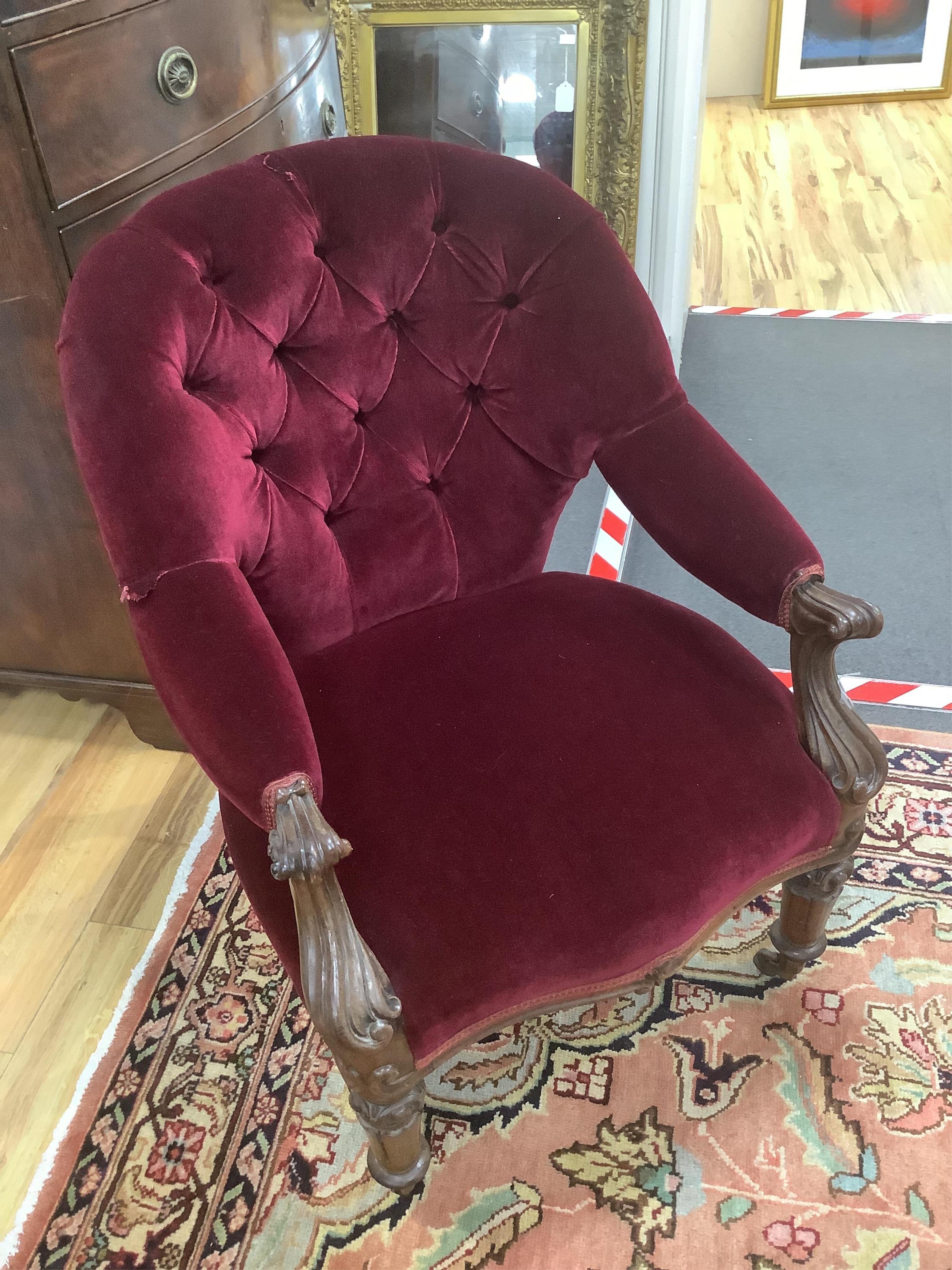 An early Victorian red velvet upholstered open armchair, width 64cm, depth 50cm, height 82cm. Condition - good